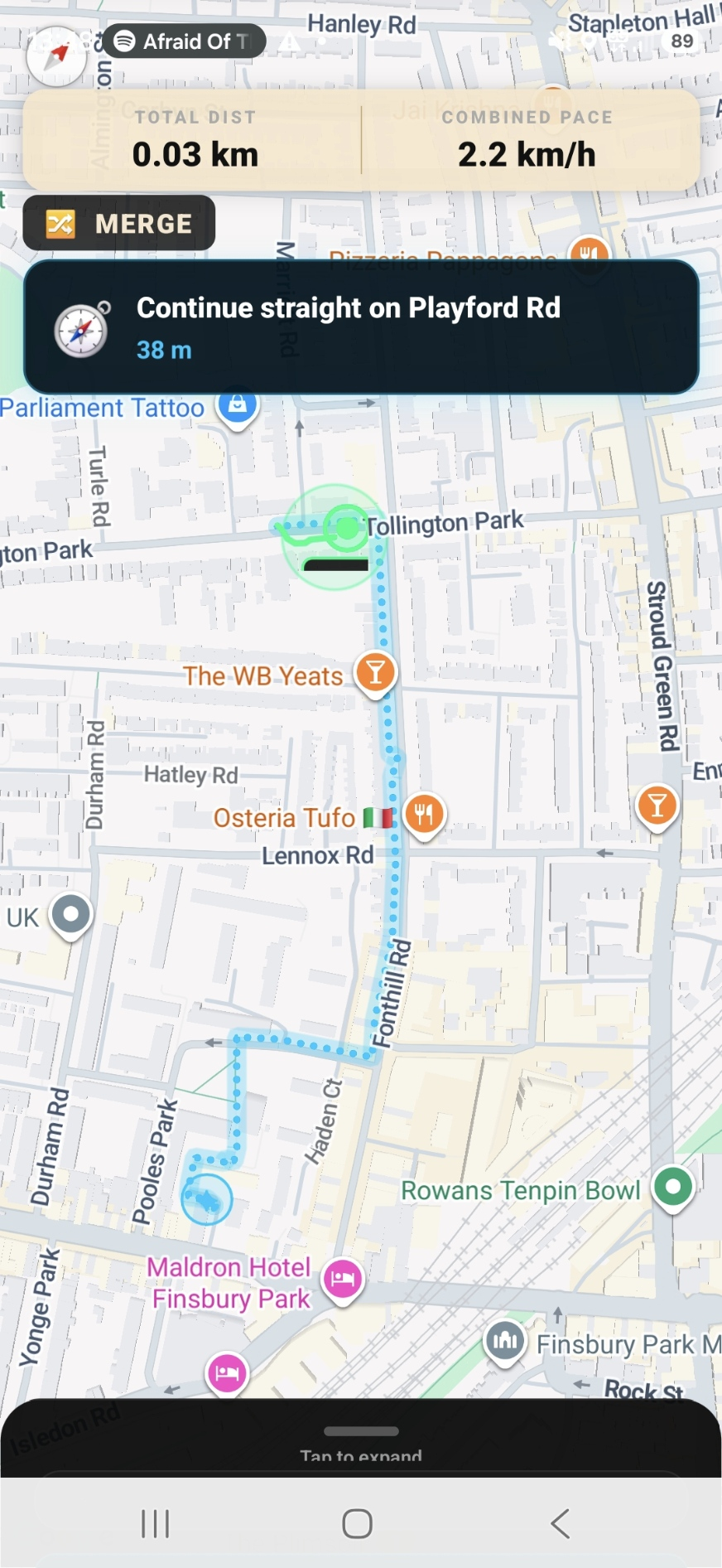 Live Merge map showing combined distance and pace with turn-by-turn navigation 'Continue straight on Playford Rd' during a shared run between two friends.